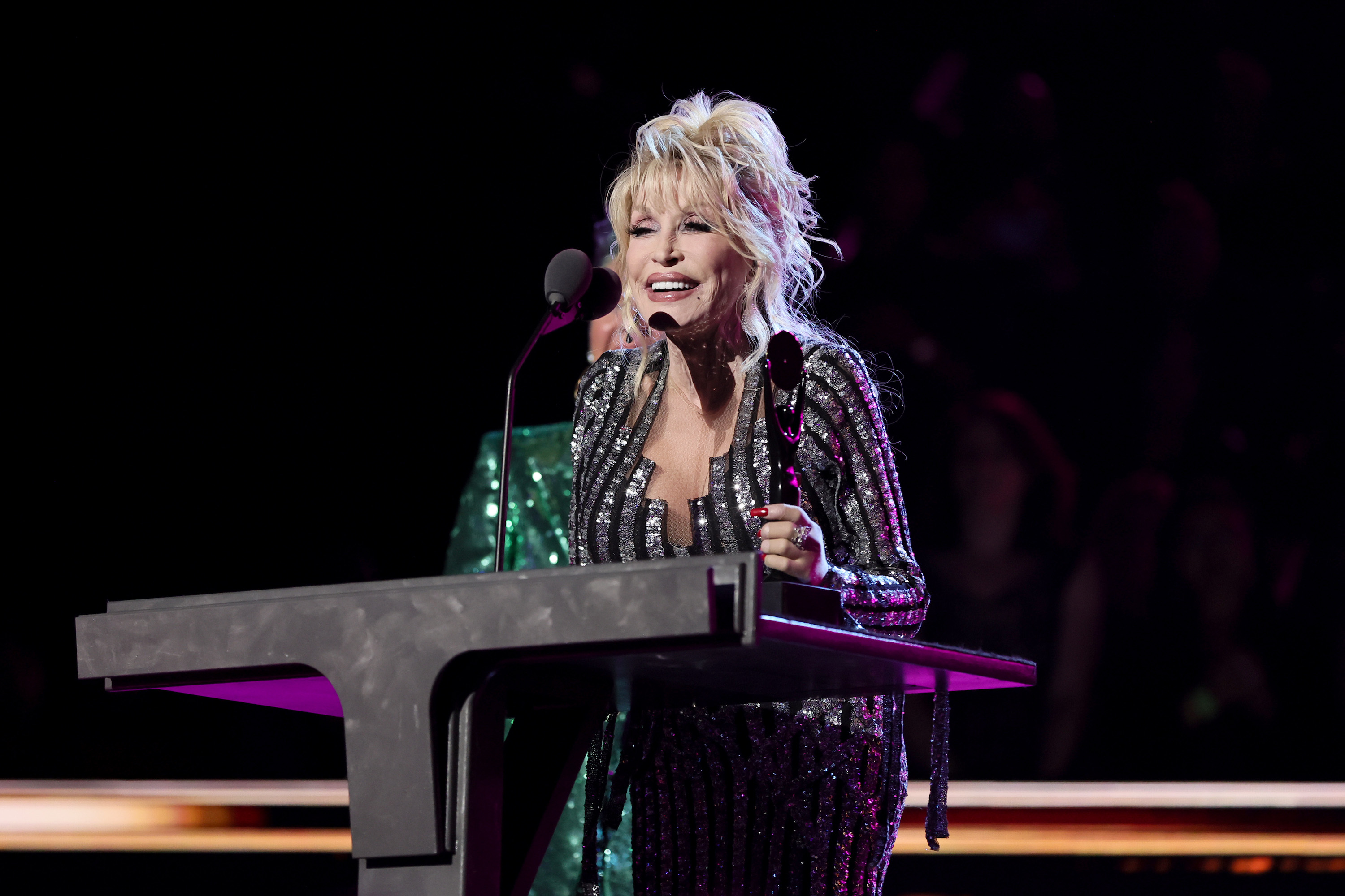 Dolly Parton speaks at the 37th annual Rock and Roll Hall of Fame Induction Ceremony