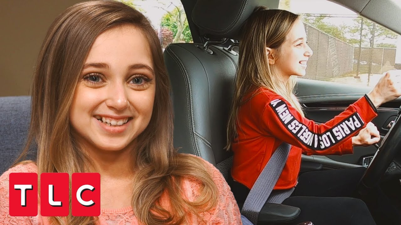 Shauna Rae sits in a car while learning to drive on I Am Shauna Rae.