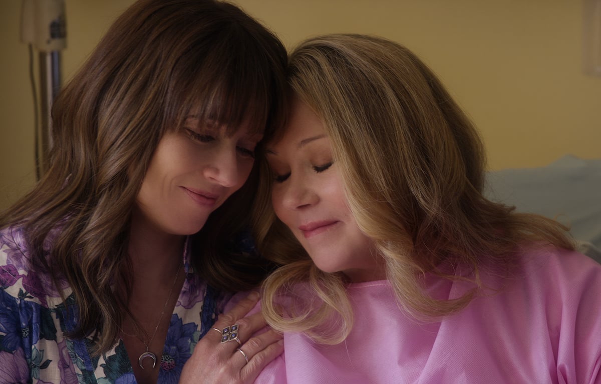 Judy (Linda Cardellini) cuddles Jen (Christina Applegate) in the finale episode of 'Dead to Me'