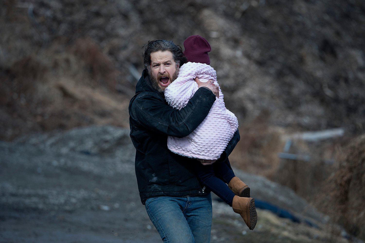 Josh Dallas as Ben Stone holding Brianna Riccio/Gianna Riccio as Eden Stone in Manifest Season 4 Part 1