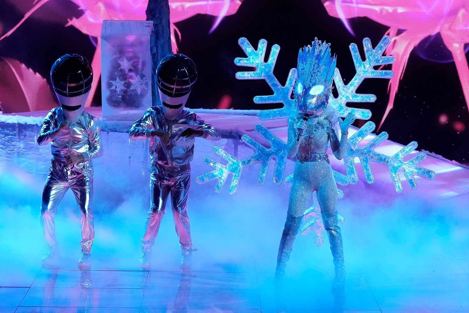 Snowstorm performs on The Masked Singer Season 8.