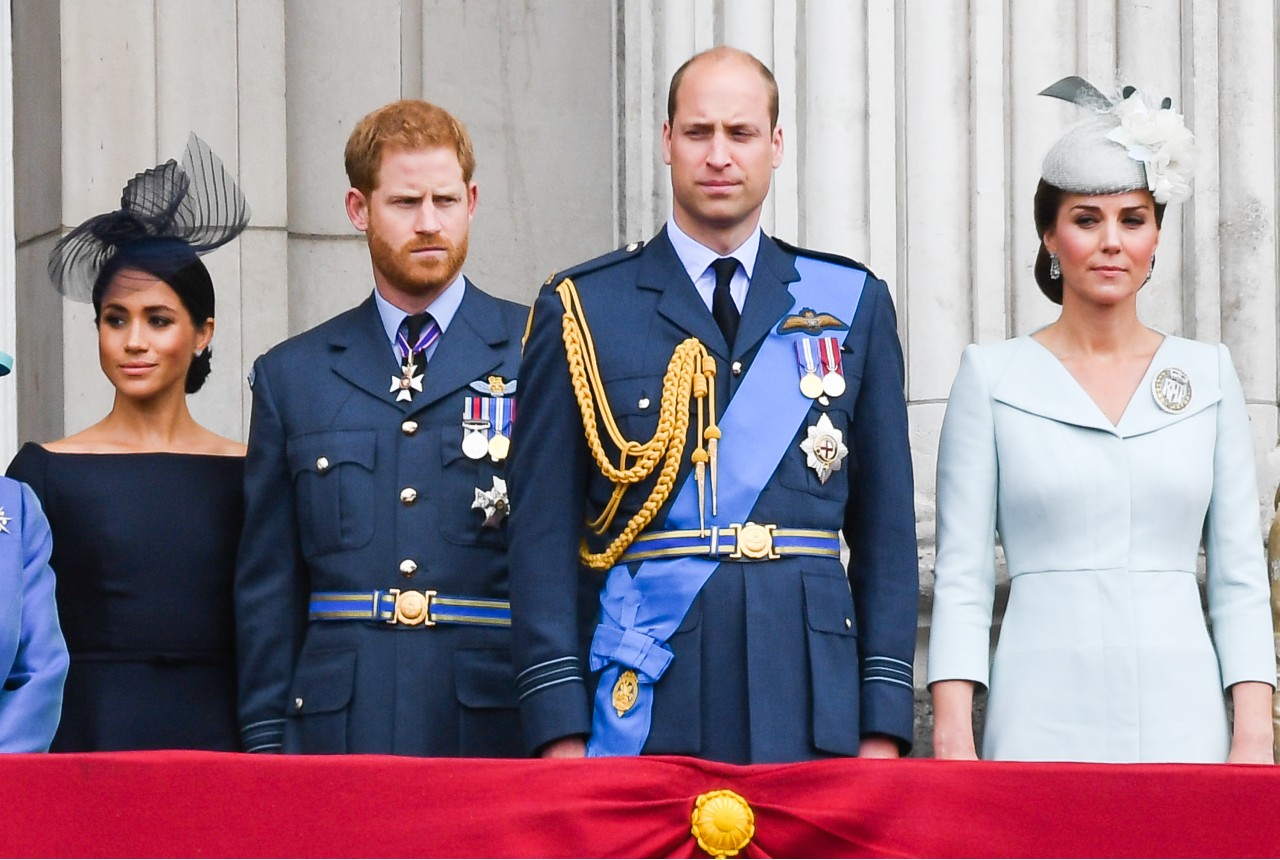 Meghan Markle and Prince Harry stand next to Prince William and Kate Middleton.