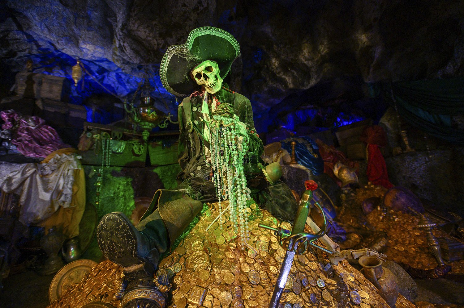 A pirate skeleton prop sitting on top of a pile of gold in the Pirates of the Caribbean episode of Prop Culture