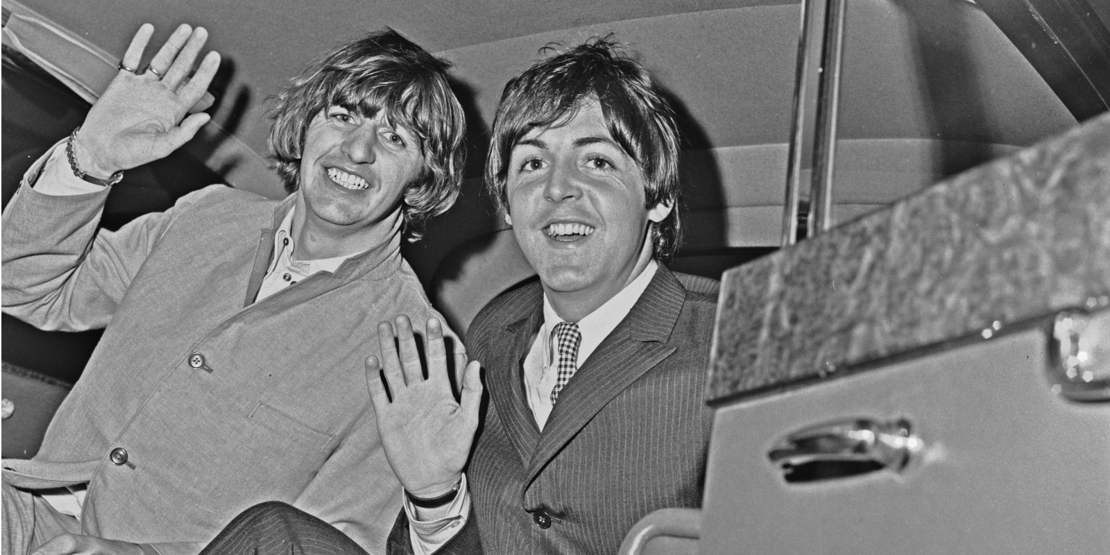 Ringo Starr (left) and Paul McCartney of English pop group the Beatles at London Airport (later Heathrow), UK, 2nd September 1965. They are returning from their tour of the US. 