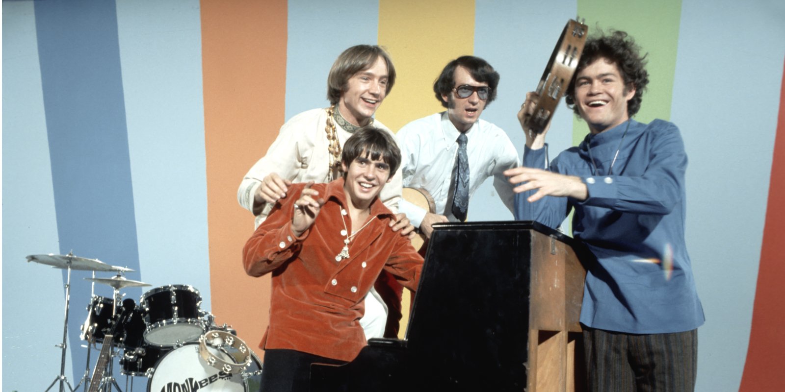 The Monkees members included Davy Jones, Peter Tork, Mike Nesmith, and Mickey Dolenz.