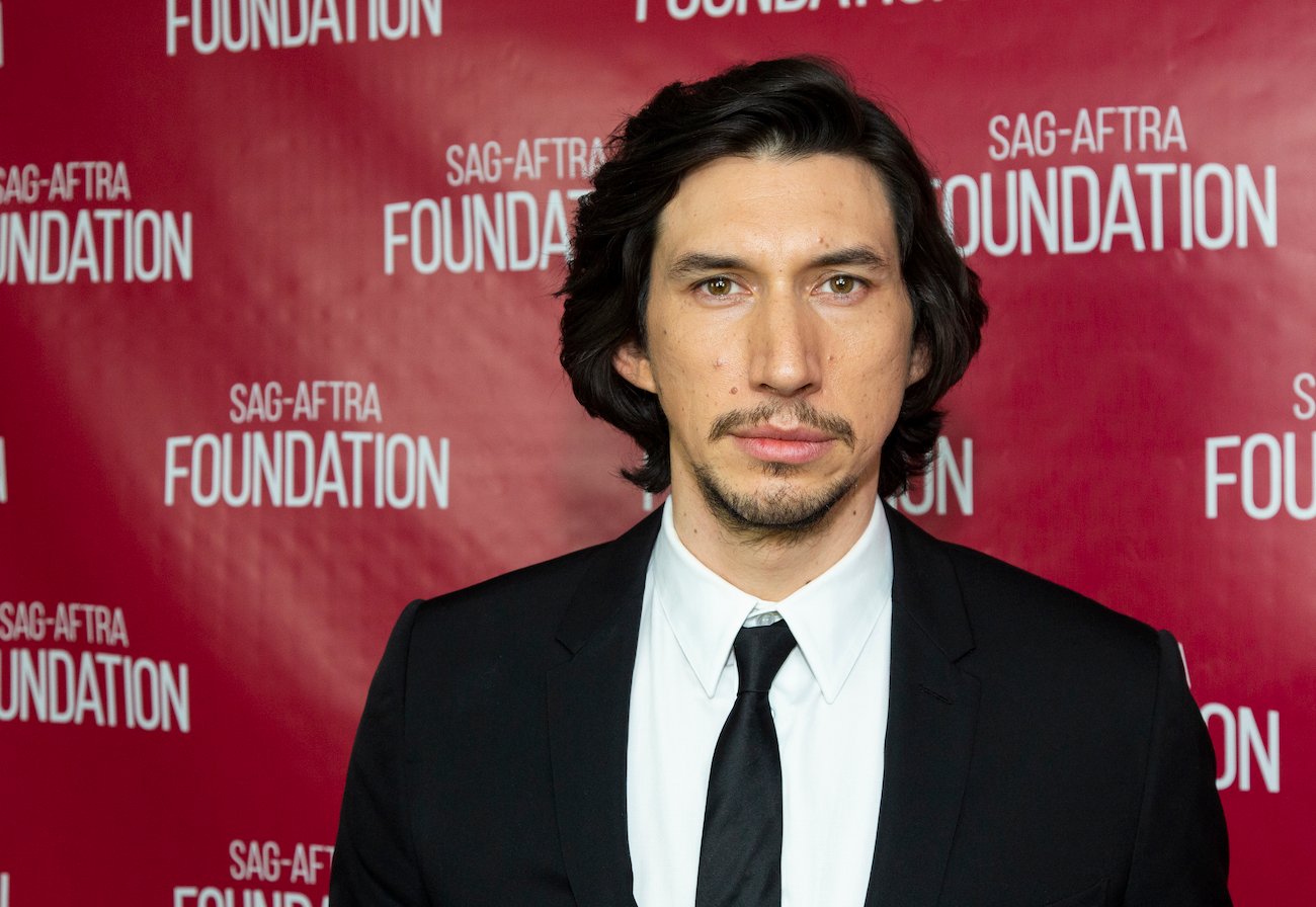 Marine veteran Adam Driver, who used to eat whole chickens every day, posing at a 2020 SAGAFTRA event