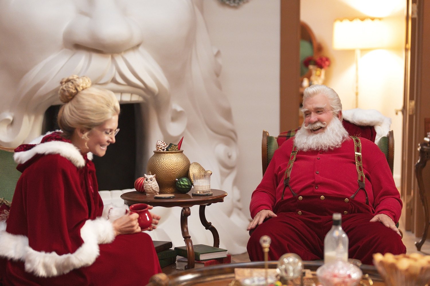 Elizabeth Mitchell as Mrs. Claus and Tim Allen as Santa Claus in The Santa Clauses, available to watch on Disney+ as a coninuation of The Santa Clause movies.