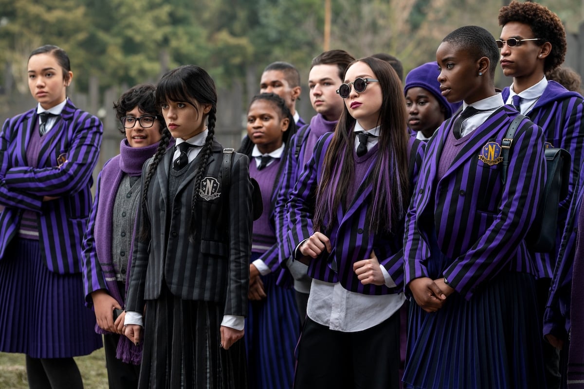 Moosa Mostafa as Eugene Otinger, Jenna Ortega as Wednesday Addams, Naomi j Ogawa as Yoko Tanaka, Joy Sunday as Bianca Barclay as they prepare for Outreach Day in 'Wednesday' on Netflix