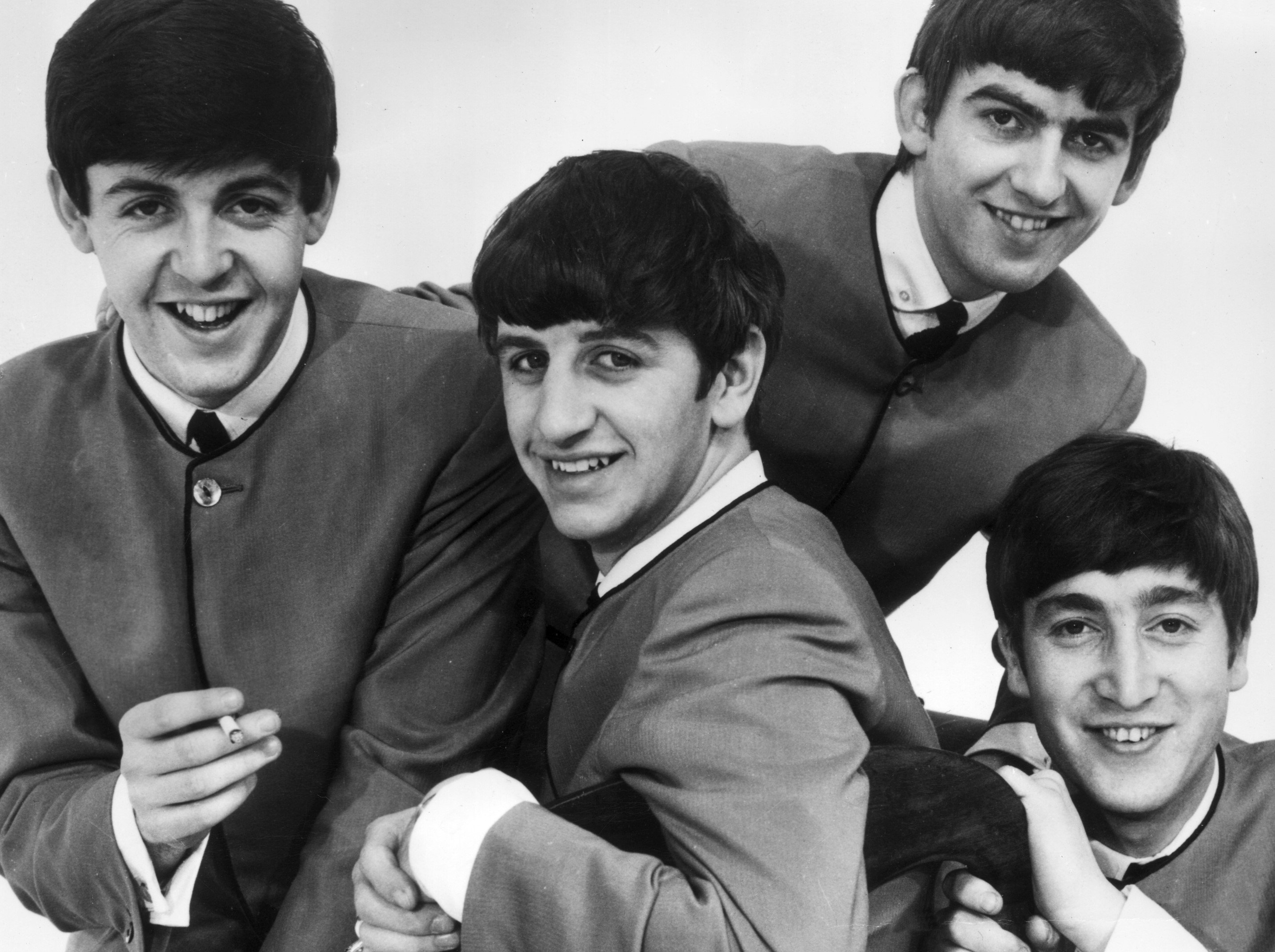 The Beatles' Paul McCartney, Ringo Starr, George Harrison, and John Lennon in black-and-white
