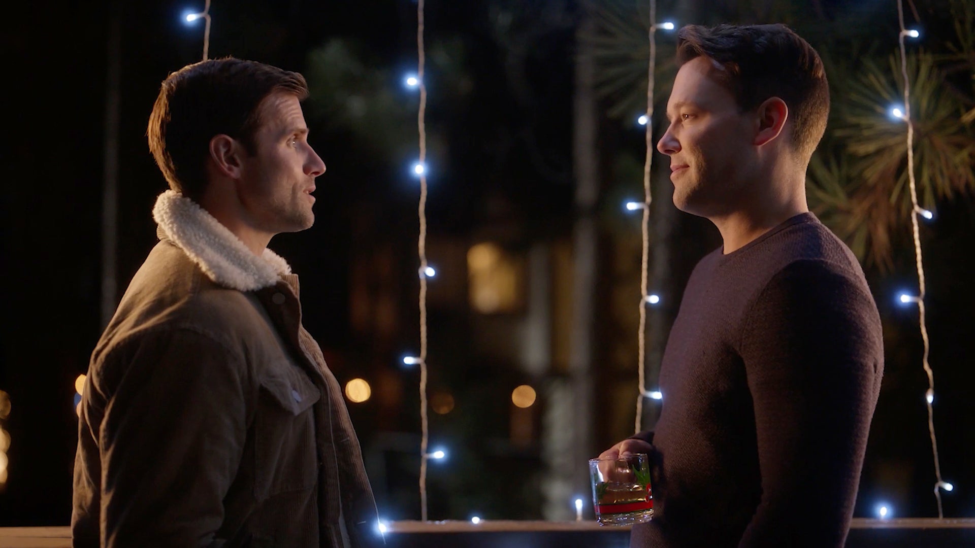Two men looking at each other in the Lifetime Christmas movie 'A Christmas to Treasure'