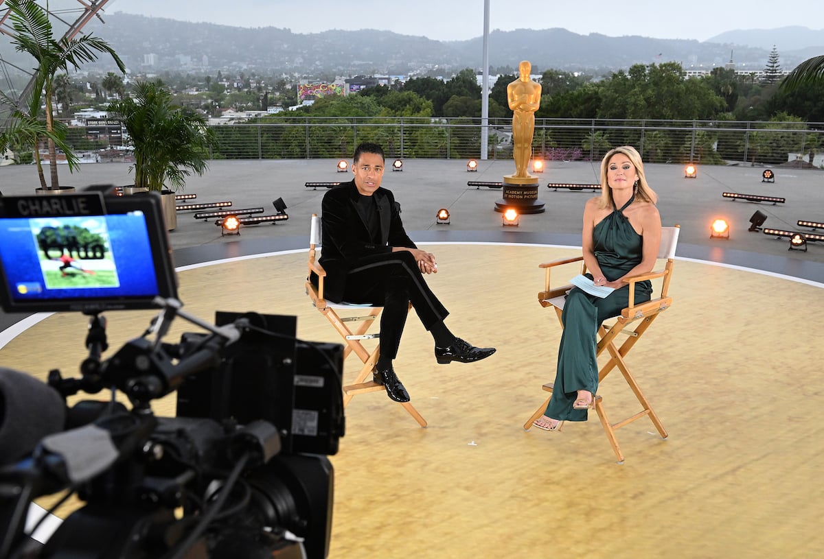 T.J. Holmes and Amy Robach sitting next to each other for 'Good Morning America'