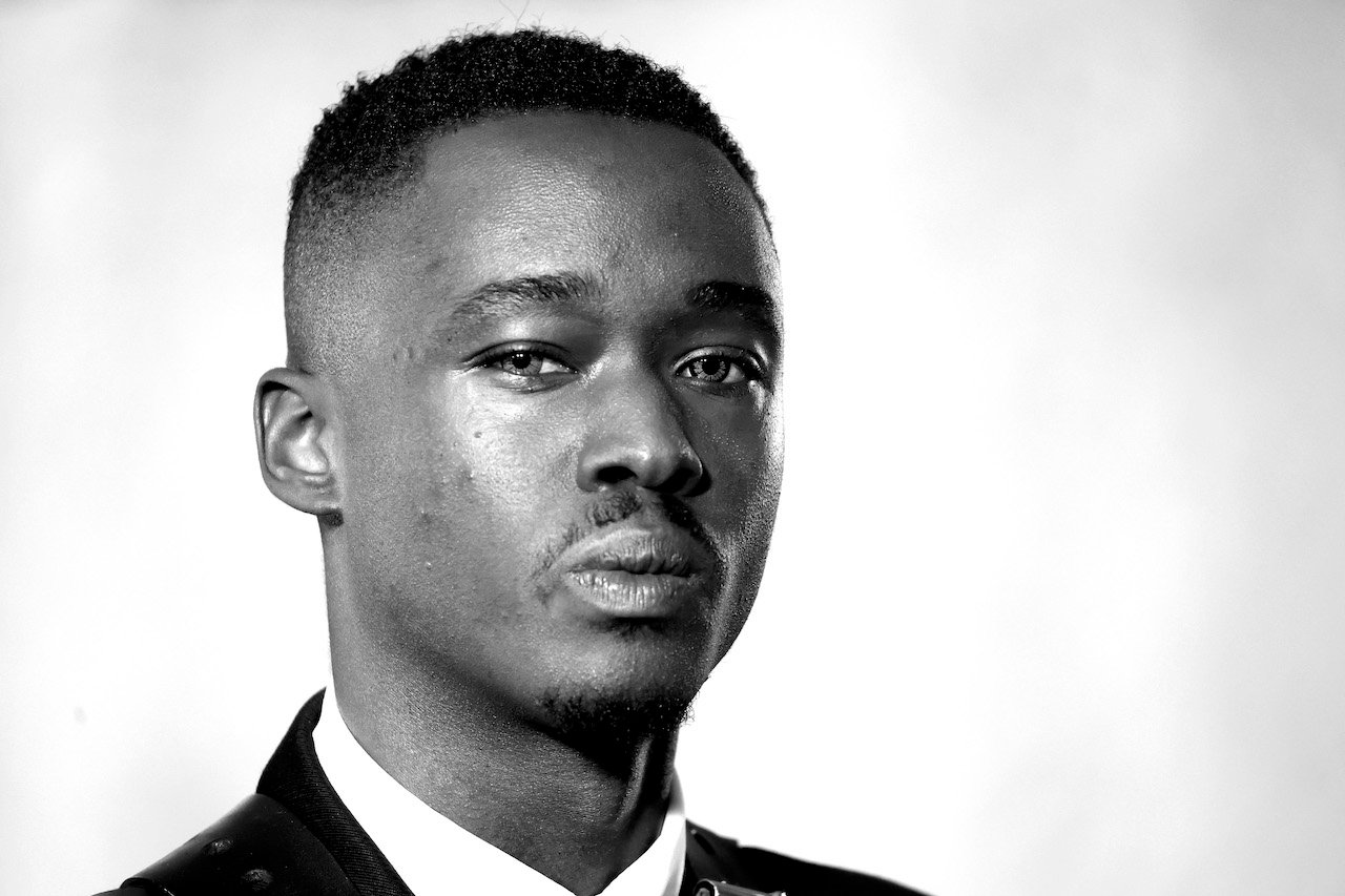 Ashton Sanders looks into camera; Sanders is starring as Bobby Brown in the Whitney Houston biopic