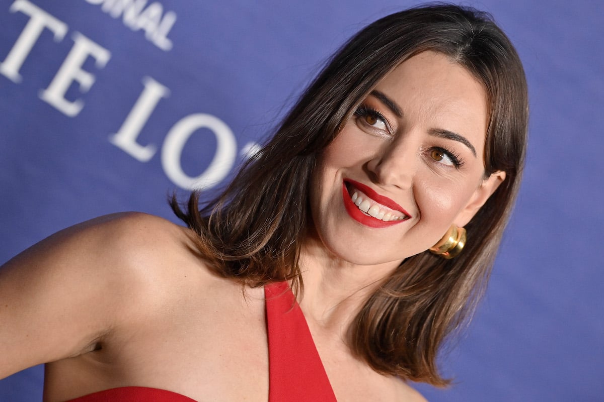Aubrey Plaza attends the Los Angeles Season 2 Premiere of HBO Original Series "The White Lotus" in a red dress and red lipstick