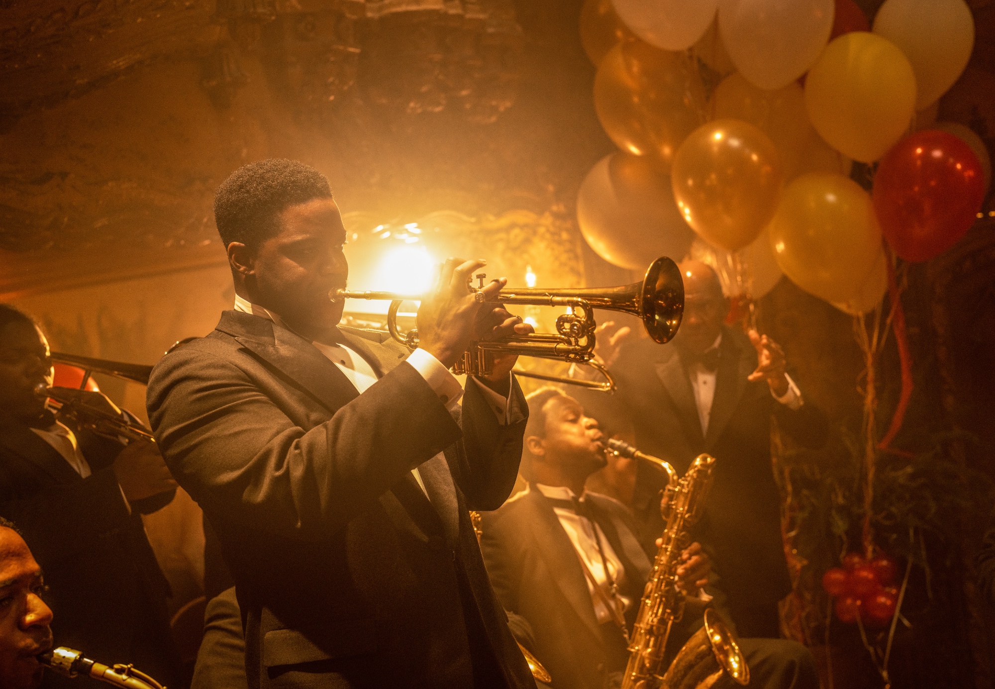 'Babylon' Jovan Adepo as Sidney Palmer playing the trumpet while wearing a tux