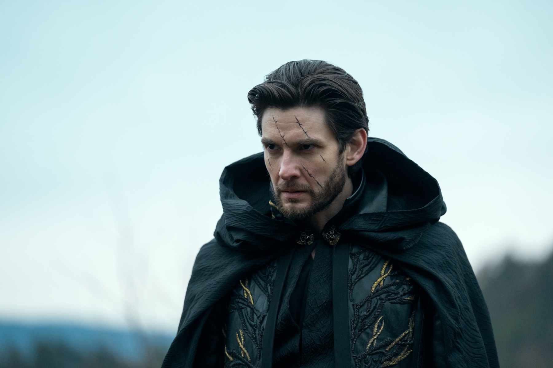 Ben Barnes as the Darkling in 'Shadow and Bone' Season 2 for our article about its release date. He's got a scar across his face and looks angry.