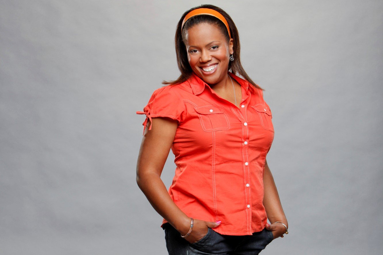 Jodi Rollins, who starred in 'Big Brother 14' on CBS, wears a button-up short sleeve orange shirt, orange headband, and dark jeans.