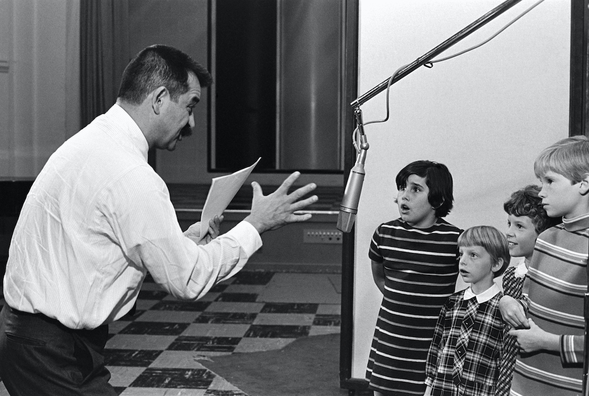 'A Charlie Brown Christmas' animator Bill Melendez with child voice actors recording dialogue for a Peanuts holiday special.