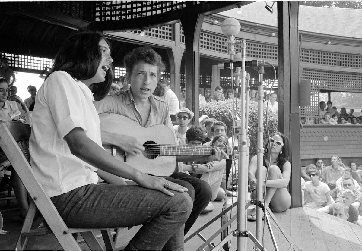 Folk musicians Joan Baez and Bob Dylan share the stage at the 1963 Newport Folk Festival in Rhode Island