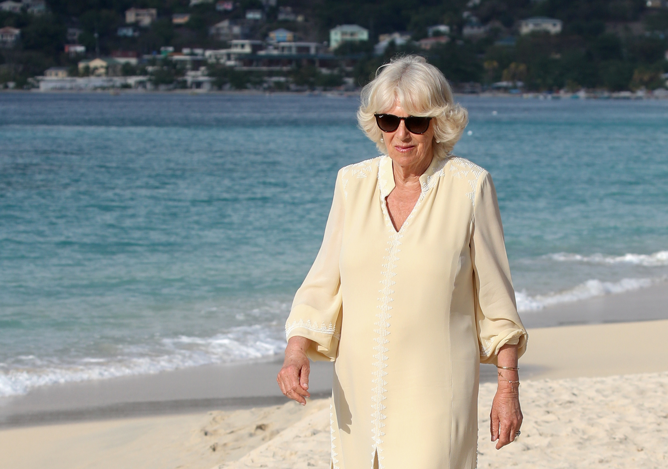 Camilla Parker Bowles attends an engagement on the beach during the official royal visit to Grenada