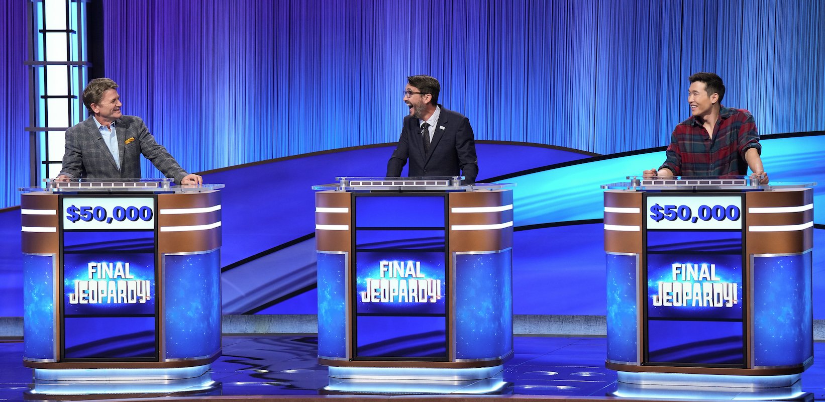 Celebrity 'Jeopardy': John Michael Higgins, Wil Wheaton and Joel Kim Booster stand at their podiums