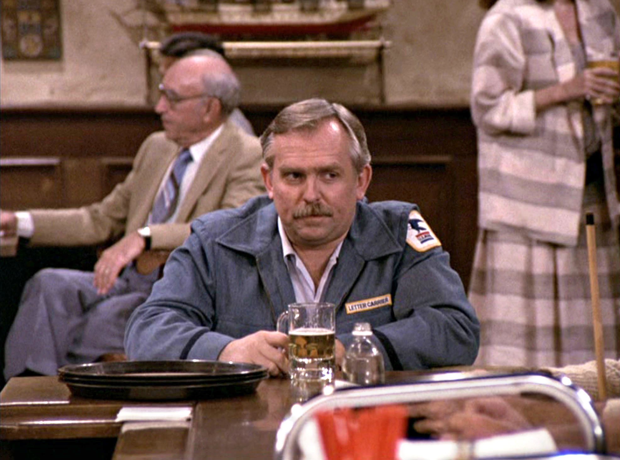 'Cheers': Cliff Clavin (John Ratzenberger) sits at the bar drinking a beer