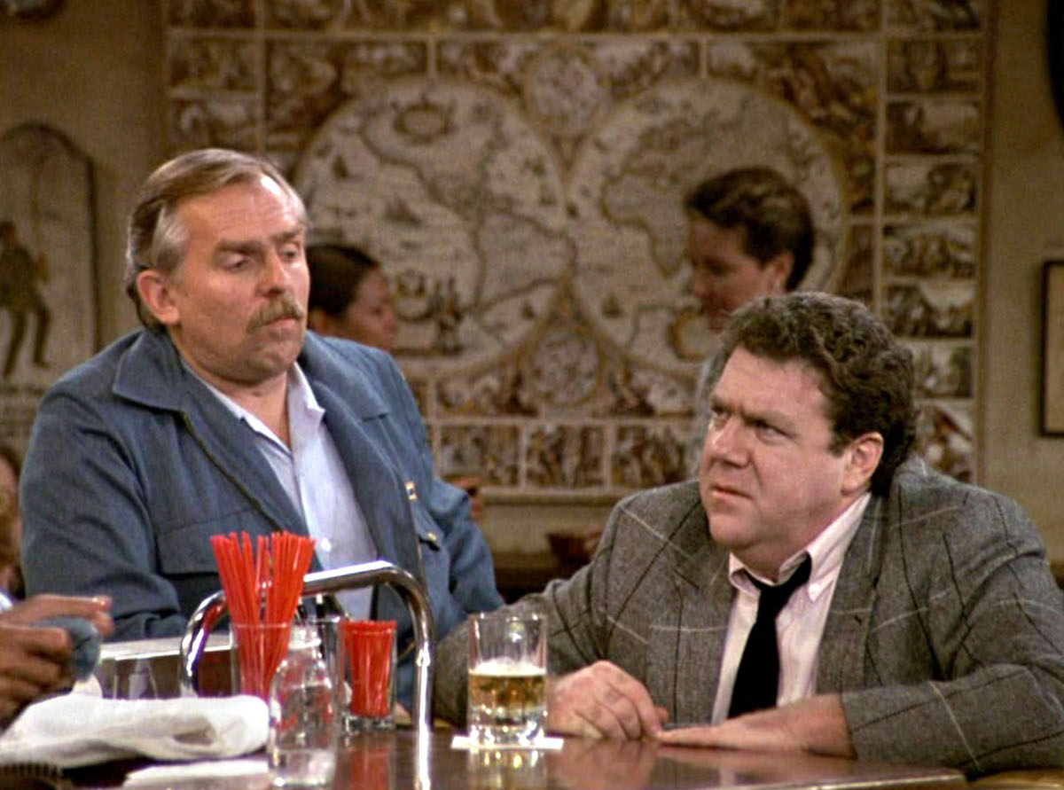'Cheers': Norm (George Wendt) sits at the bar while Cliff (John Ratzenberger) stands