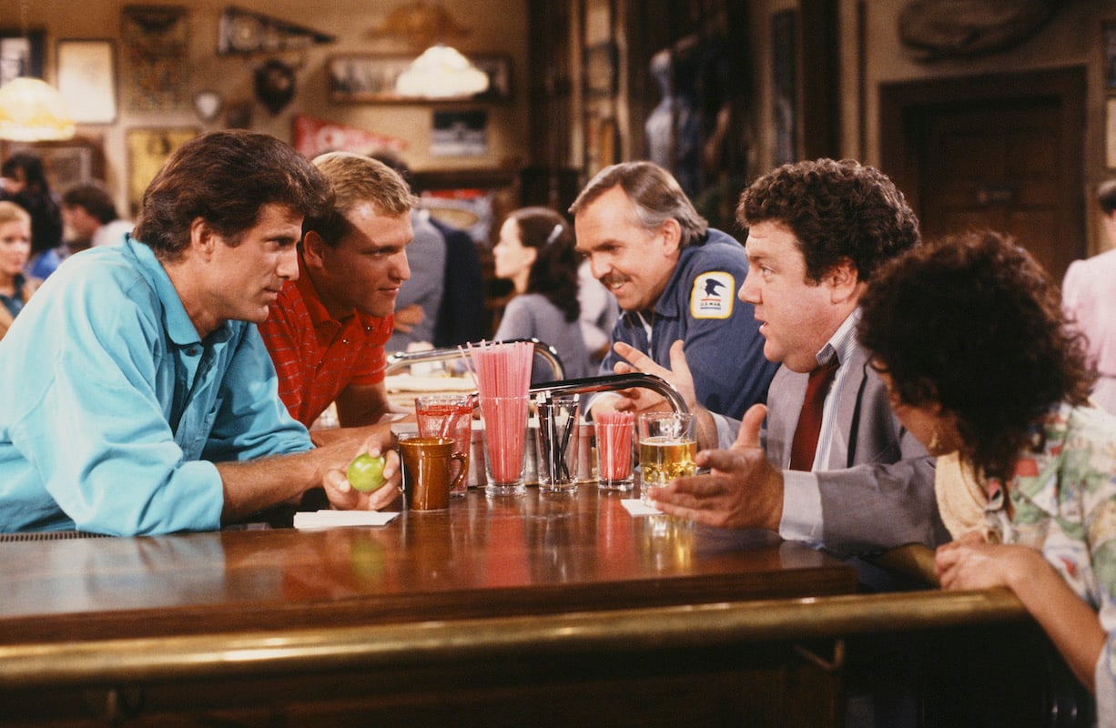 'Cheers' beer: Ted Danson, Woody Harrelson, Jon Ratzenberger, George Wendt and Rhea Perlman gather over a fake beer on the bar