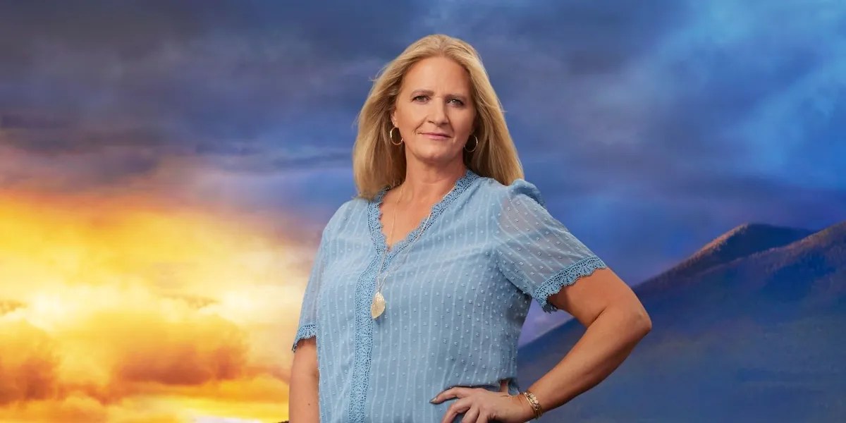 Christine Brown standing in front of a mountain in promo photo for 'Sister Wives' Season 17 on TLC.