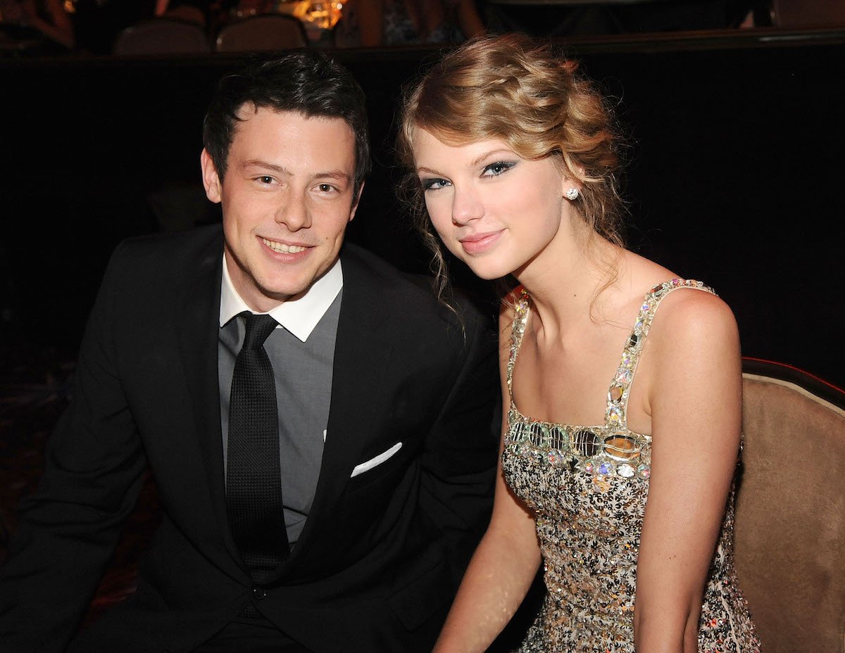 Cory Monteith and Taylor Swift, who allegedly wrote a song for the "Glee" star, smile and pose for the camera while seated together at an event.