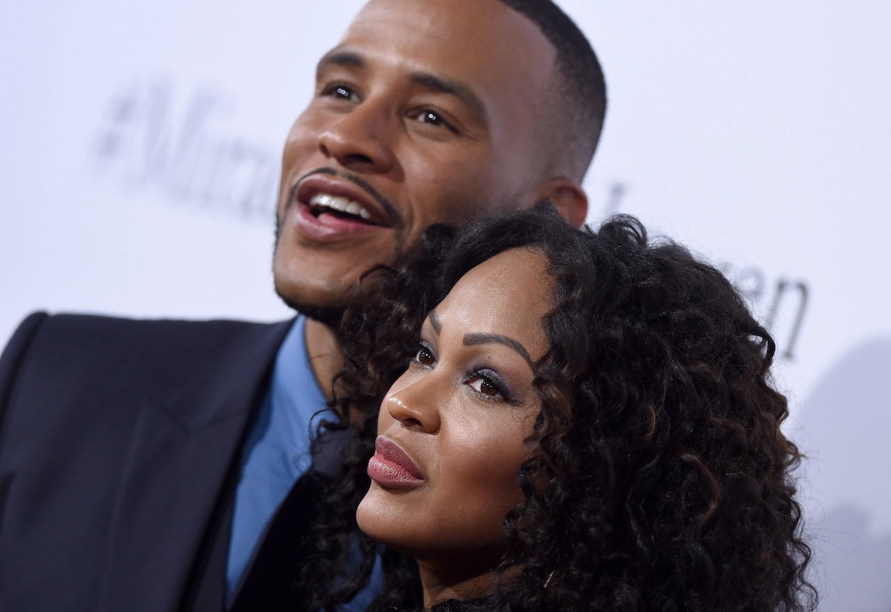 DeVon Franklin and Meagan Good pose on red carpet; Franklin is opening up about heartbreak since split