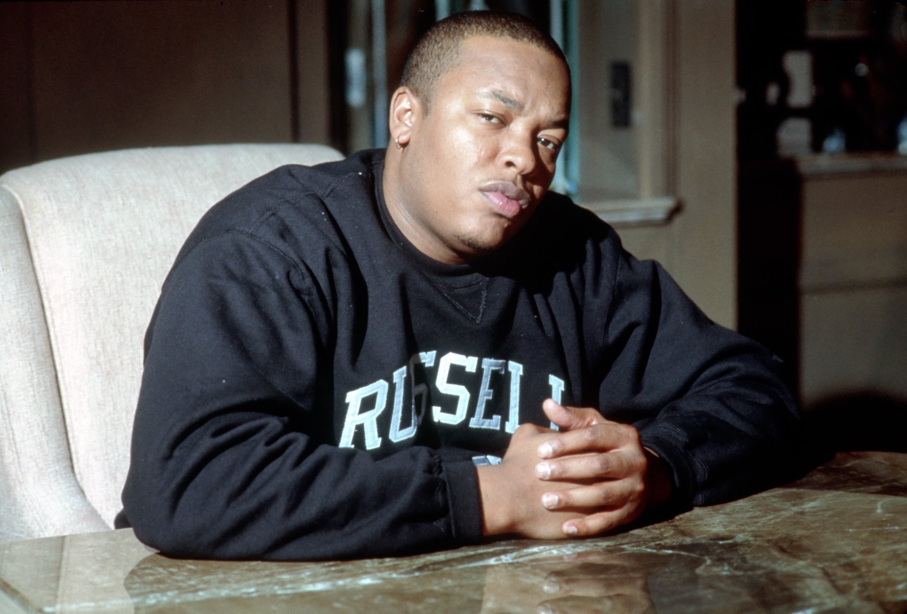 Dr. Dre, whose debut album 'The Chronic' inspired The Notorious B.I.G.'s own debut album, seated for a photo in 1992