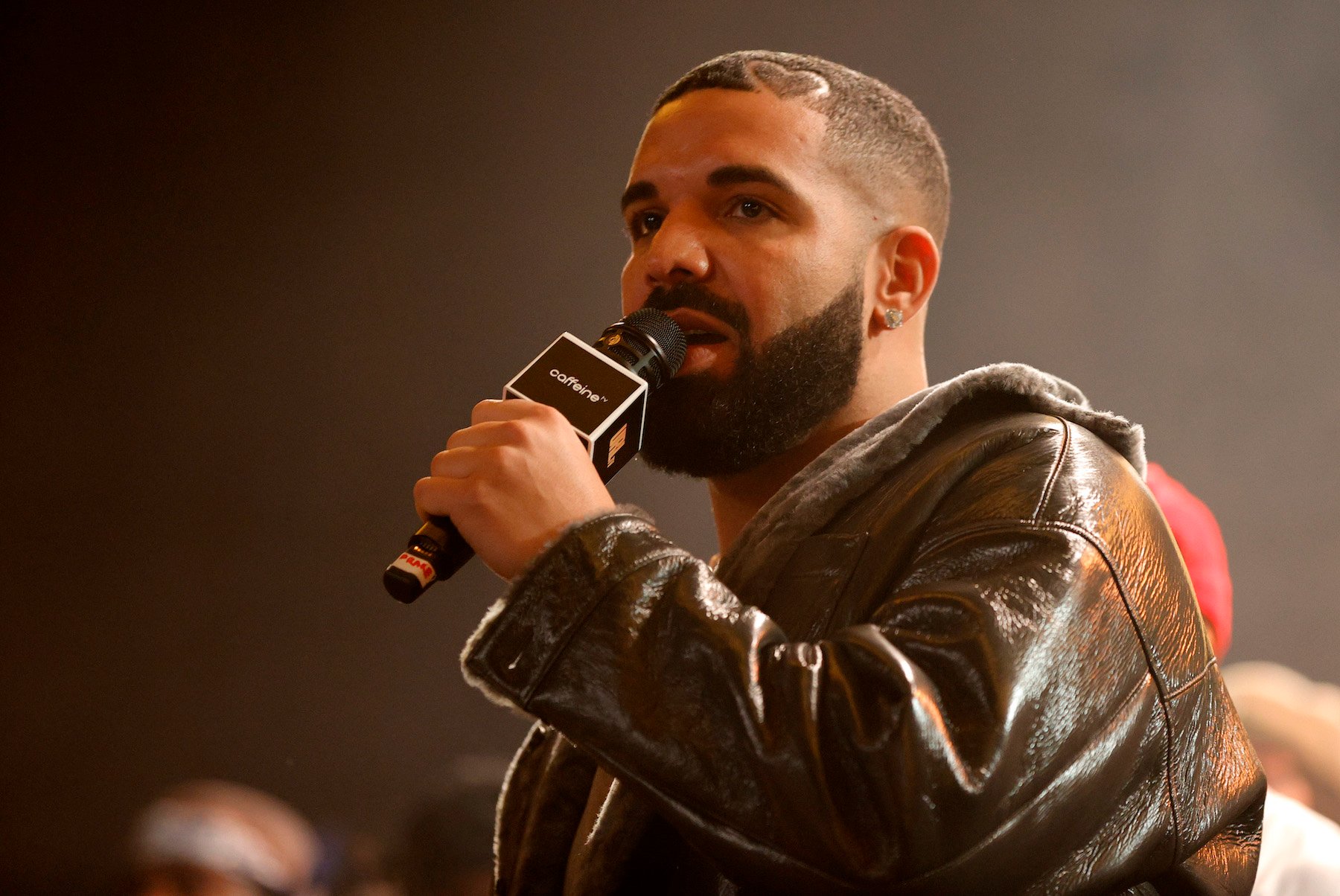 Drake, who faced a lawsuit over his song 'Way 2 Sexy,' speaking into a mic