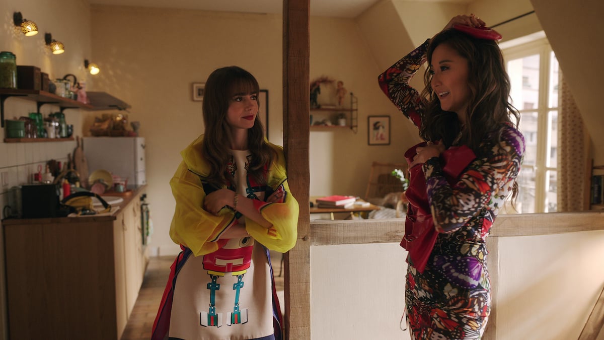 'Emily in Paris' season 3 production still with (L to R) Lily Collins as Emily, Ashley Park as Mindy