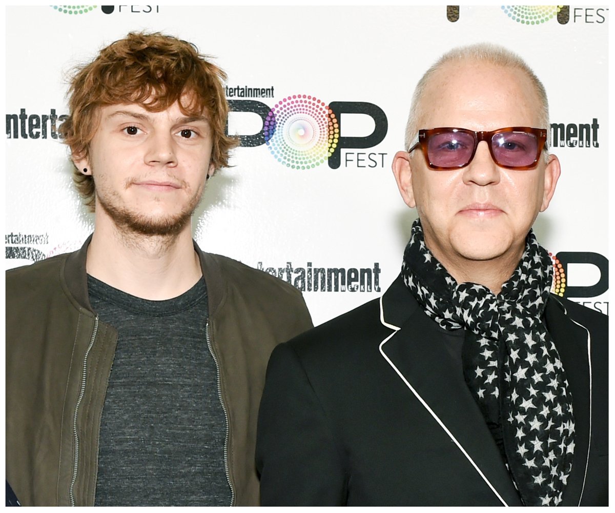 Evan Peters and Ryan Murphy pose together at an event.