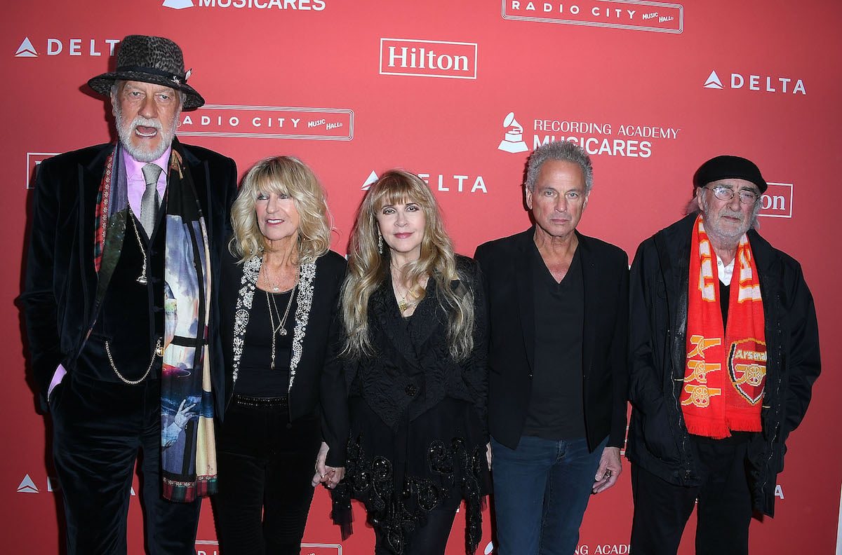 Fleetwood Mac, who wrote "Go Your Own Way," poses together at an event.