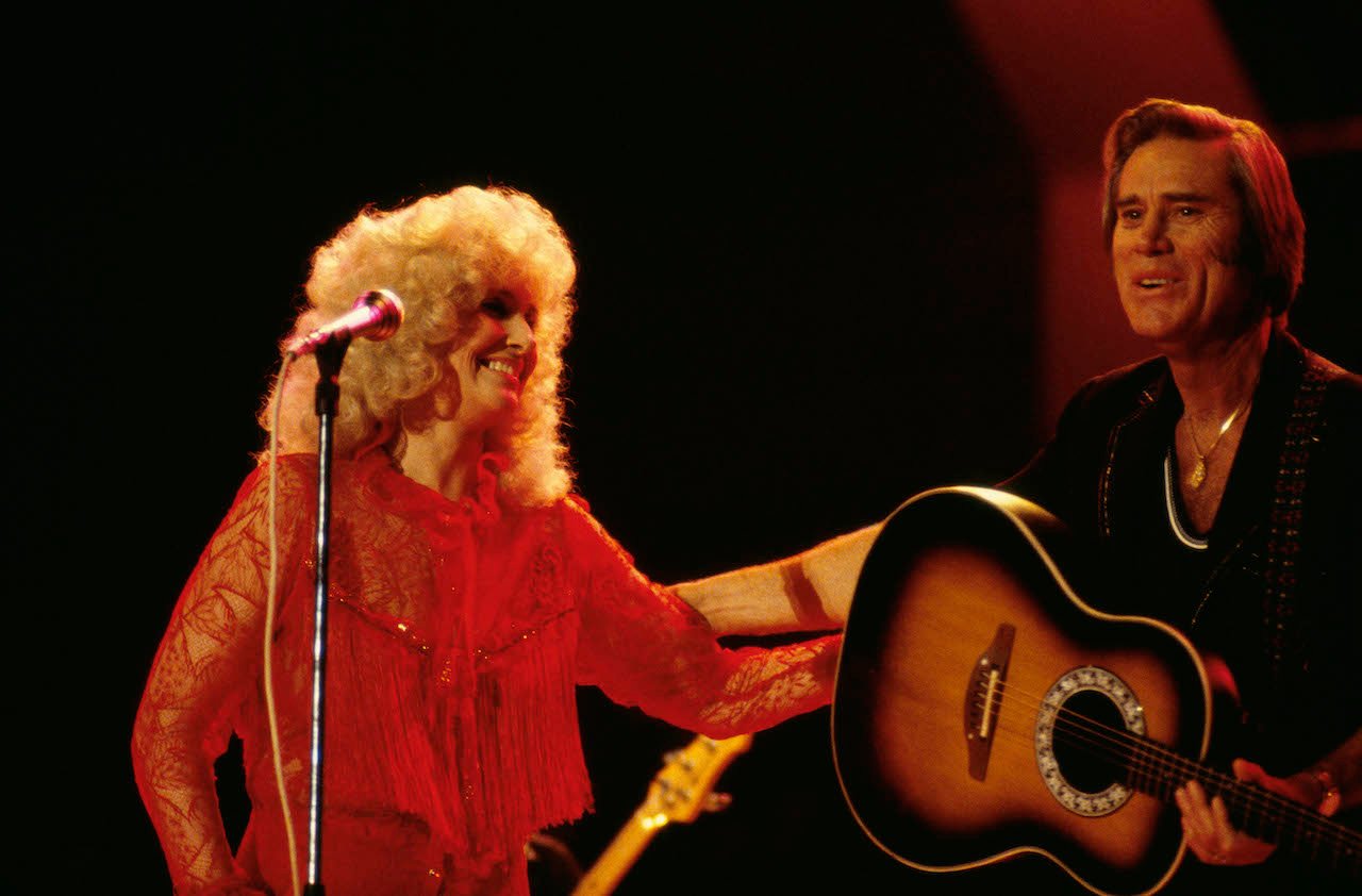 Tammy Wynette and George Jones perform live on stage at the Country Music Festival, Wembley Arena, London in April 1981.