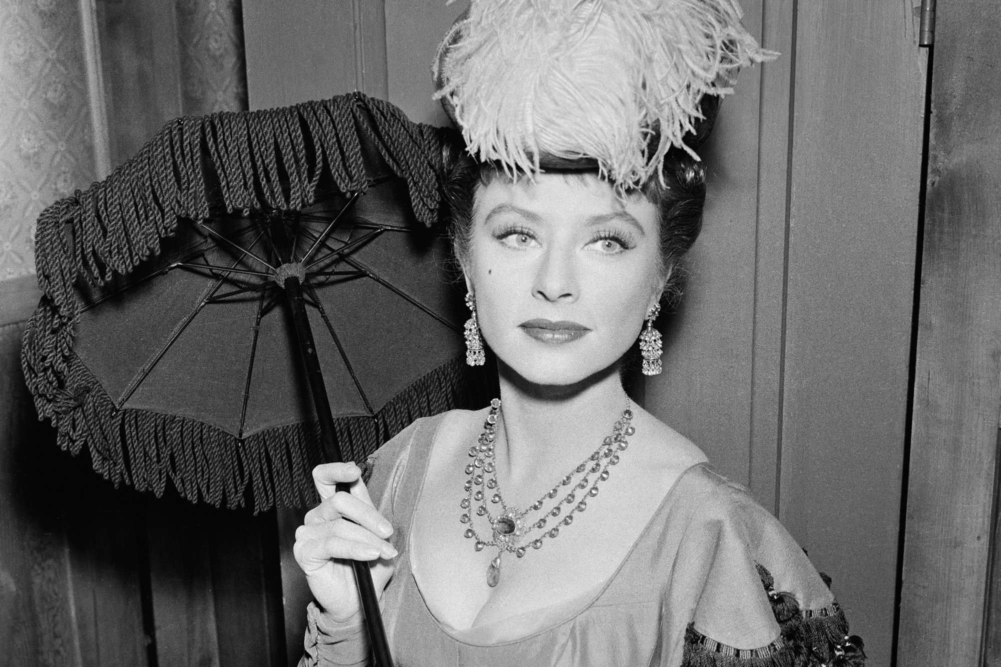 'Gunsmoke' Amanda Blake as Miss Kitty Russell in a black-and-white picture holding an umbrella