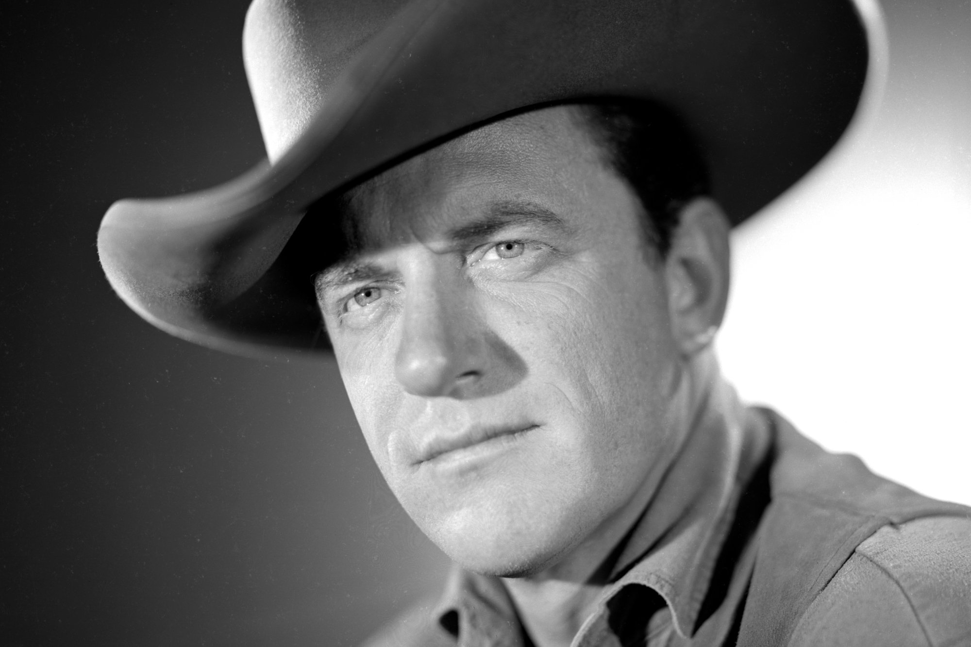 'Gunsmoke' James Arness as Matt Dillon in a black-and-white picture wearing a cowboy hat