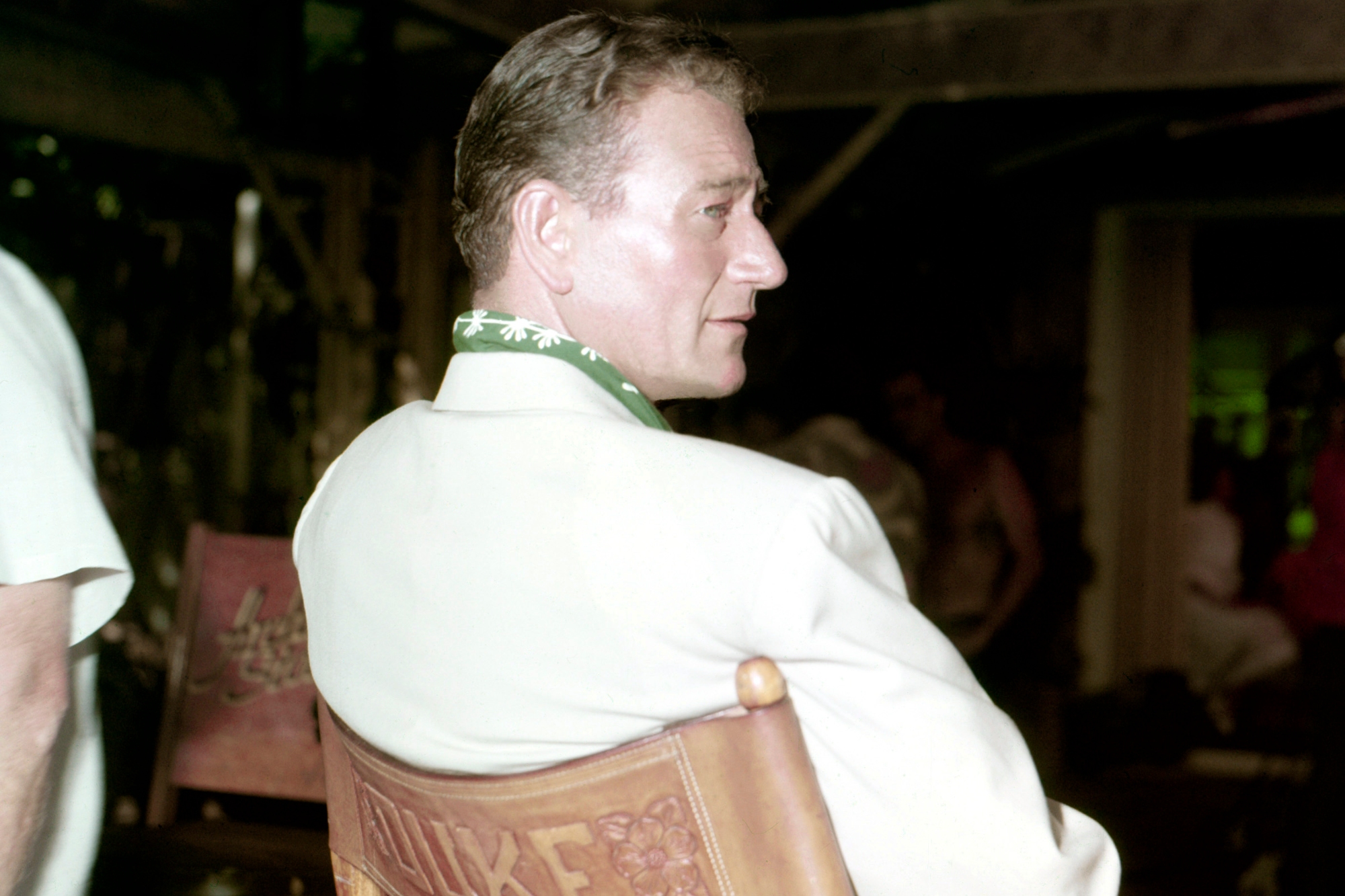 'Hondo' star John Wayne sitting in a director's chair