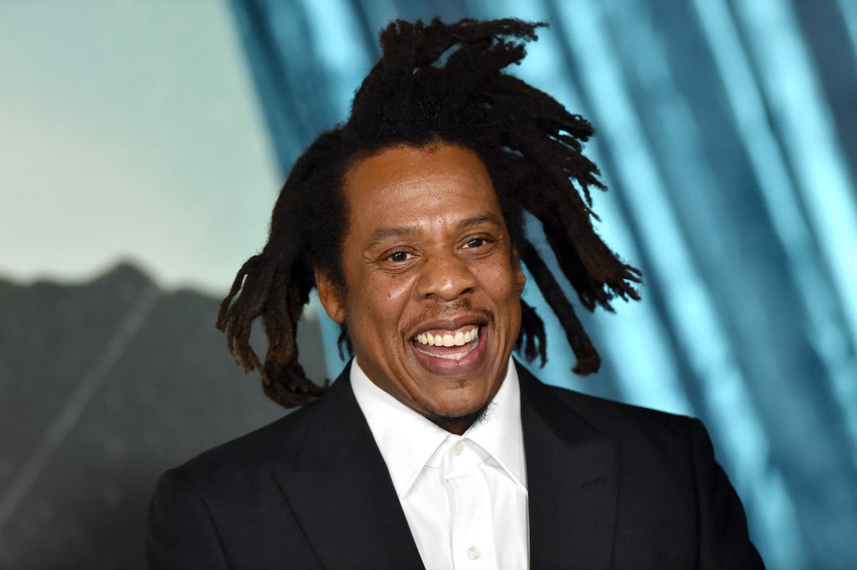 Jay-Z smiling in front of a blurred background