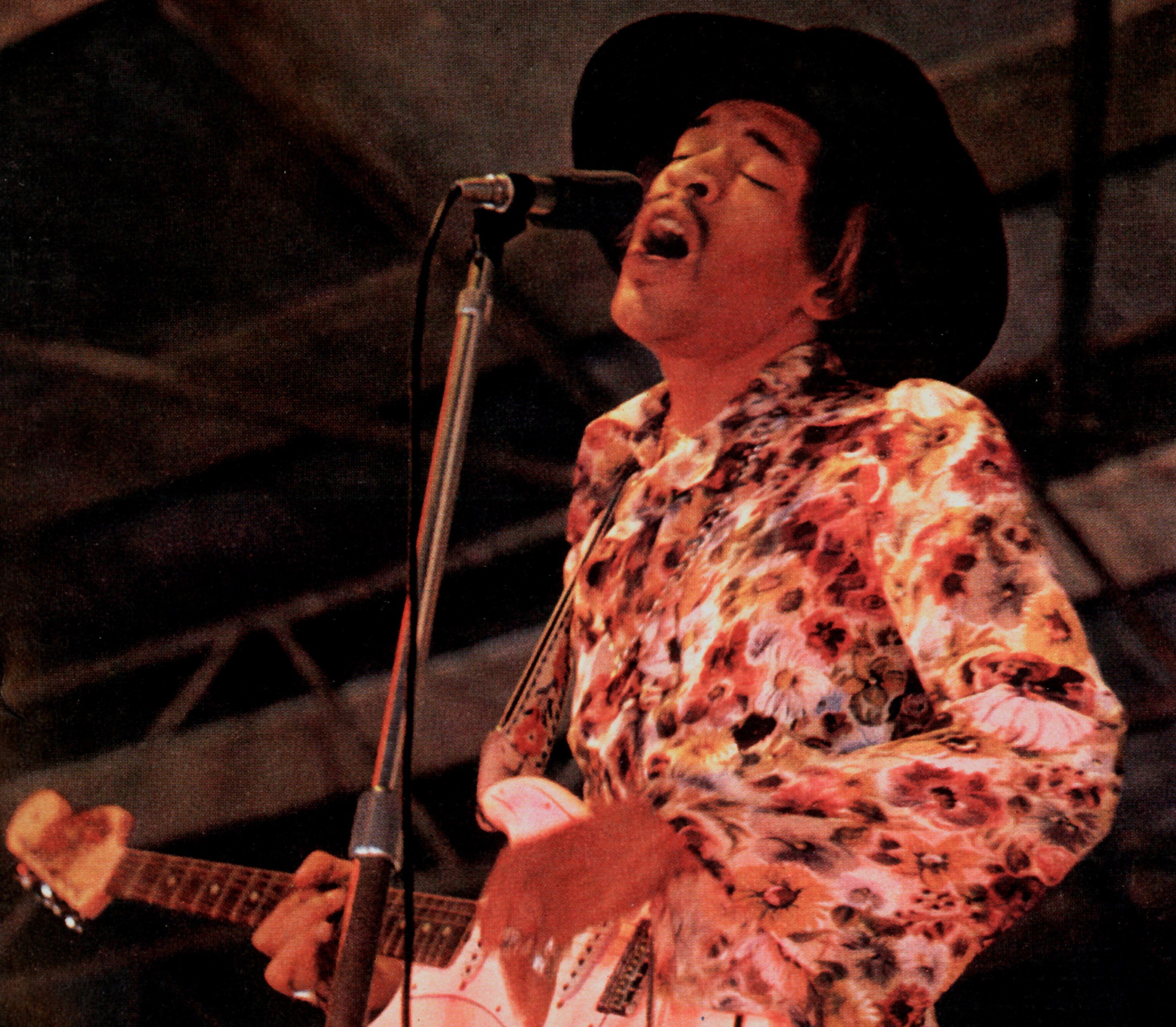 Jimi Hendrix playing a guitar