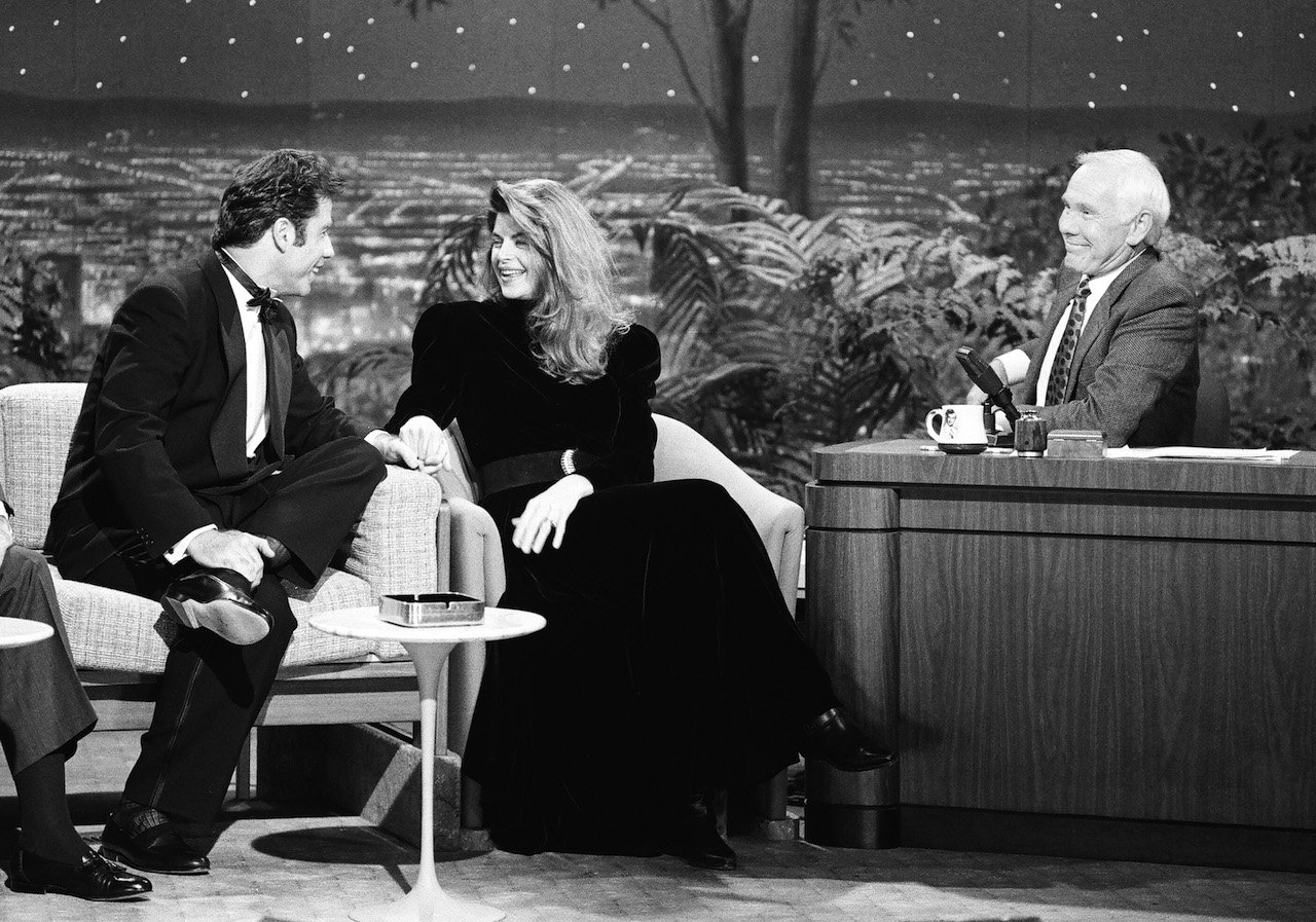 (l-r) John Travolta, Kirstie Alley, and Johnny Carson during a 'Tonight Show' interview on December 13, 1990. Travolta paid tribute to Alley after her death.