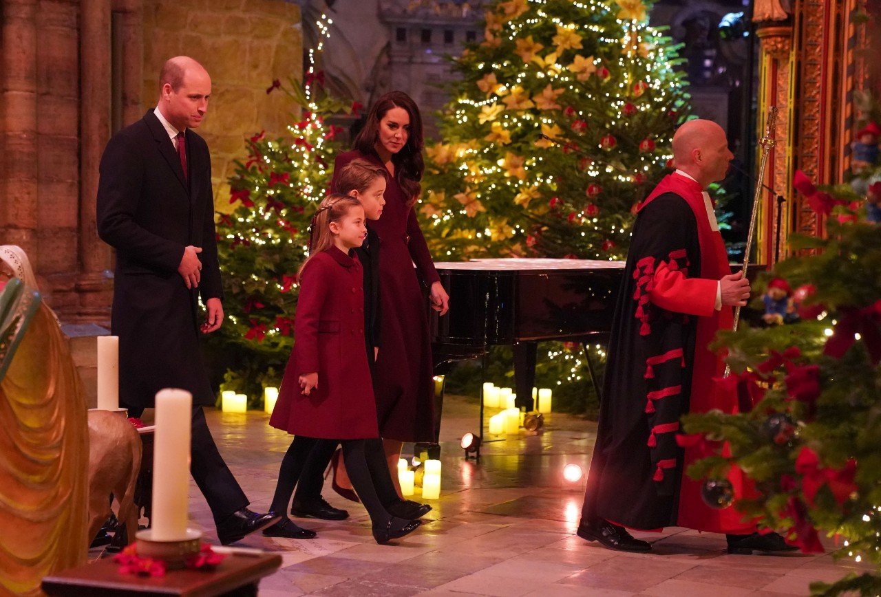 Kate Middleton and Prince William attend the Together at Christmas carol concert. Kate used color to show 'strong bonds and unity' says a body language expert.
