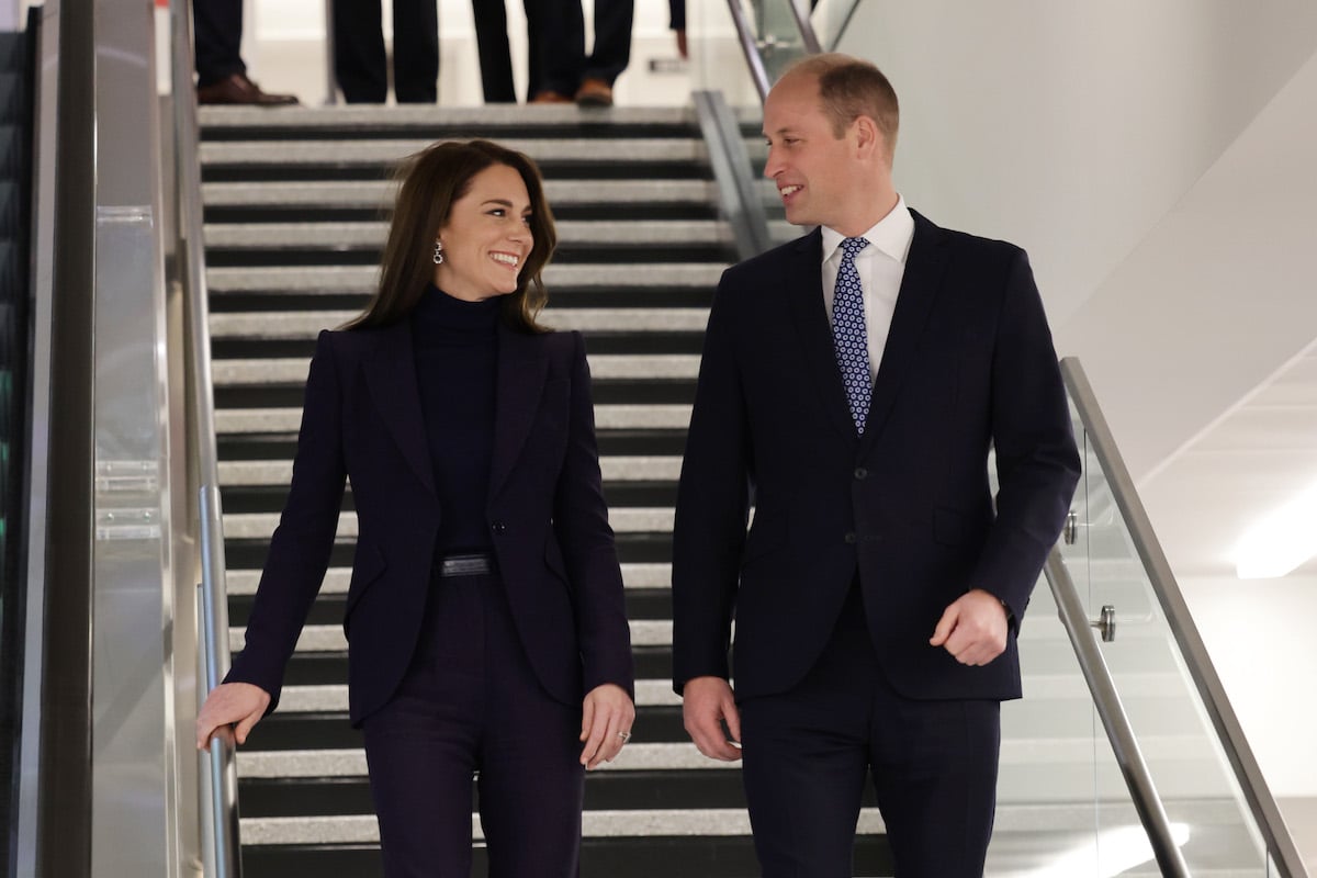 Kate Middleton, wearing a Sarah Burton for Alexander McQueen pantsuit, and Prince William arrive in Boston, Mass., on Nov. 30, 2022