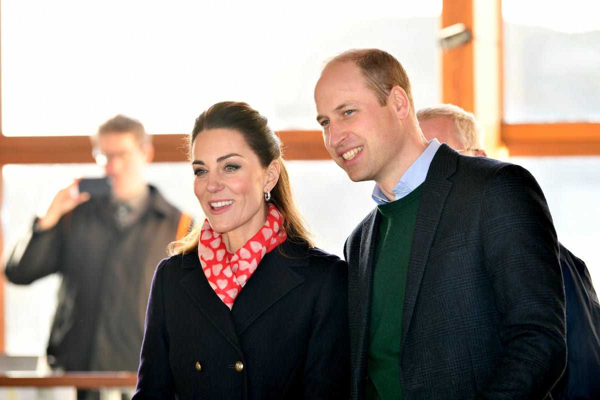 Kate Middleton and Prince William, who appeared to change their body language by being for affectionate in public, according to an expert, smile and look on in South Wales