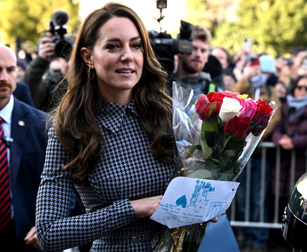 Kate Middleton, who showed Prince Harry and Meghan Markle aren't taking 'down' her and Prince William with their Netflix docuseries, according to a commentator, holds flowers during a visit to Harvard University