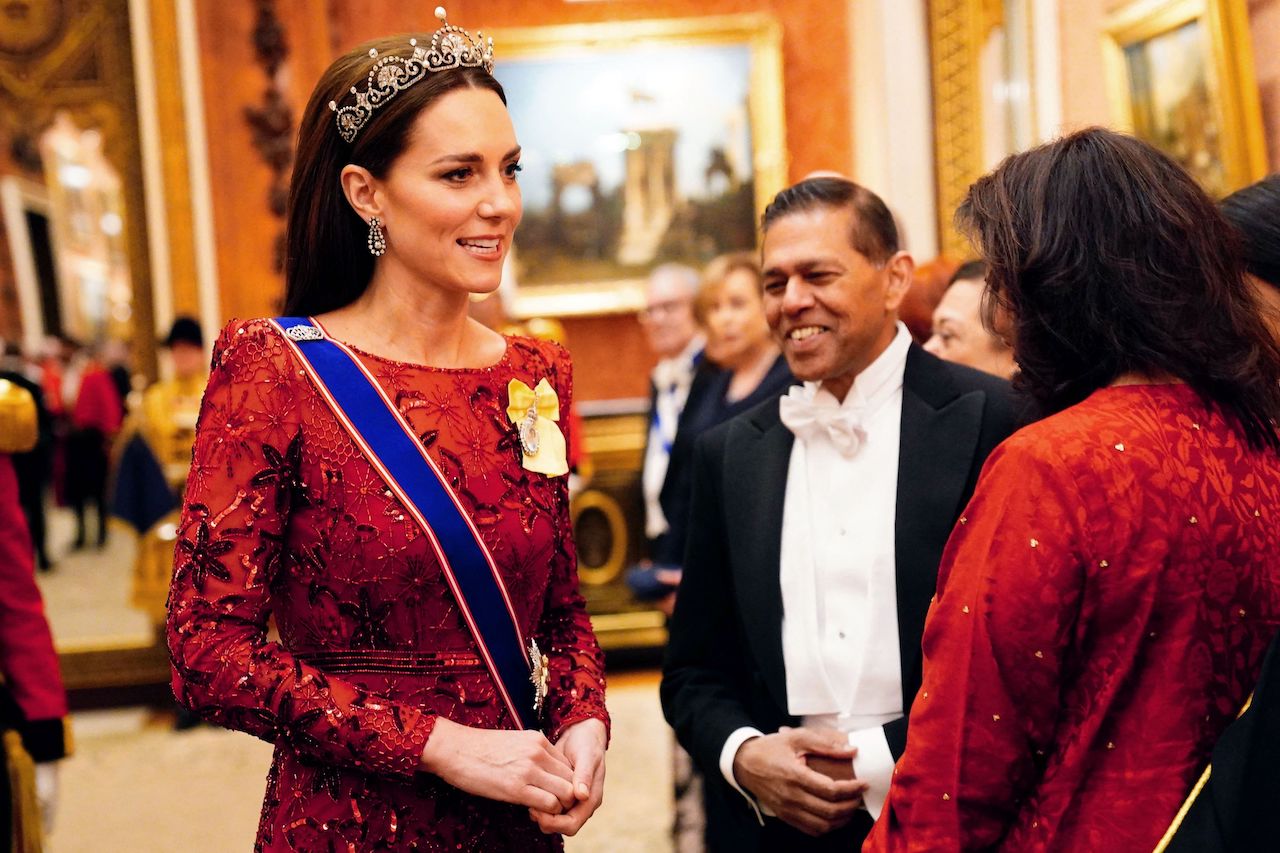Kate Middleton, Princess of Wales, speaks to guests during a Diplomatic Corps reception at Buckingham Palace in London late on December 6, 2022.