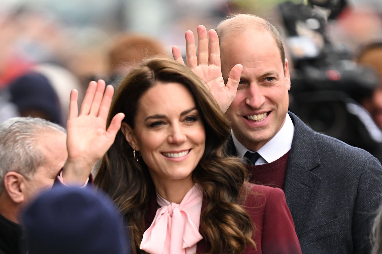 Kate Middleton and Prince William wave to a crowd during their 2022 visit to Boston.