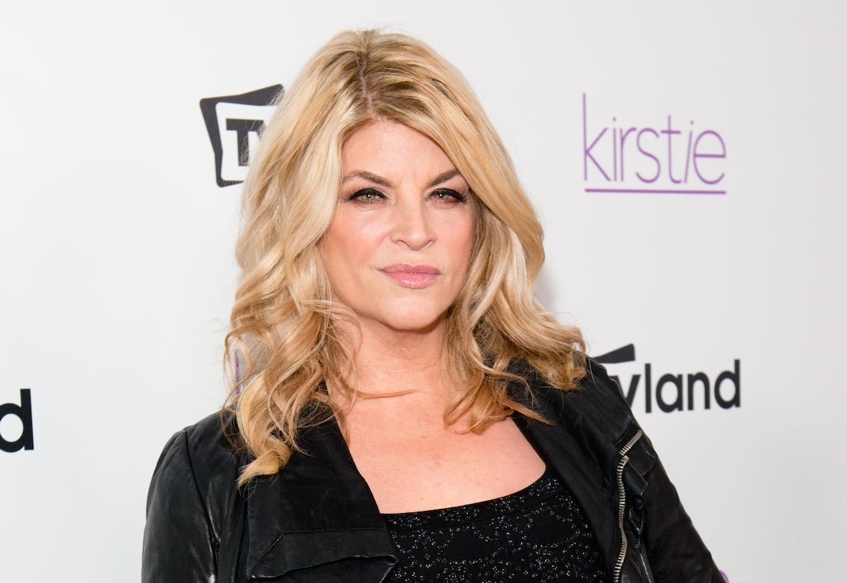 Kirstie Alley, who had 14 pet lemurs, smiles and poses at an event.