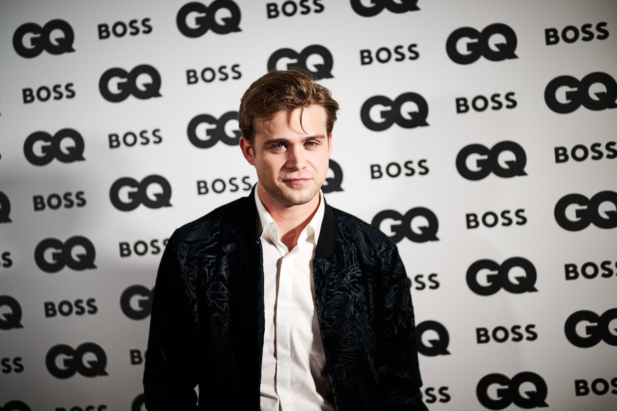 Leo Woodall attends the GQ Men Of The Year Awards 2022 in a black jacket and white button-up